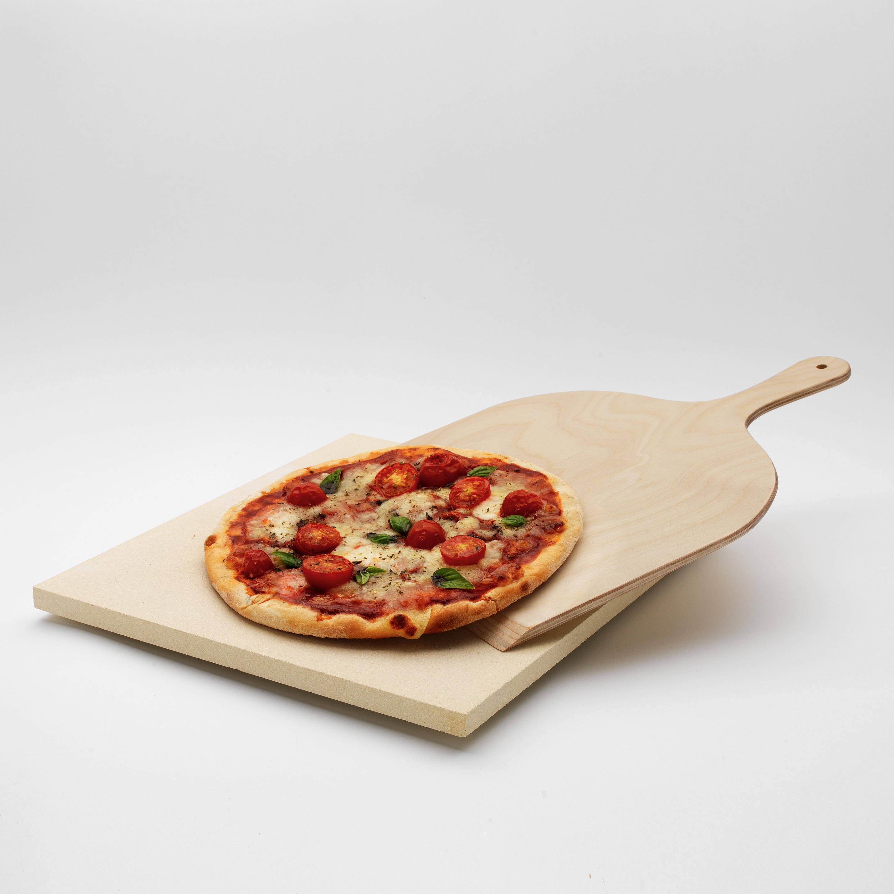 Pizza Stone Set med en pizza